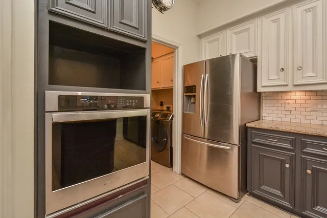 a kitchen with stainless steel appliances granite countertop a stove and a sink