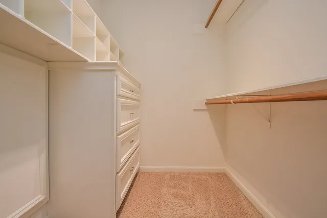 a sink with a granite countertop cabinets