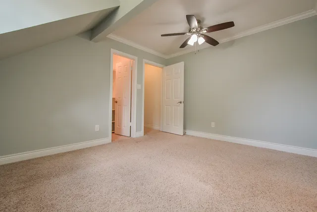 a bathroom with a granite countertop toilet and sink