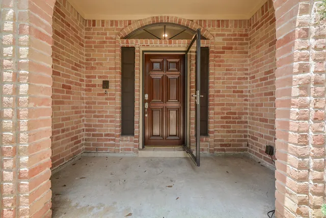 a view of a wooden door with a window