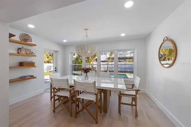 a dining room with furniture and a window