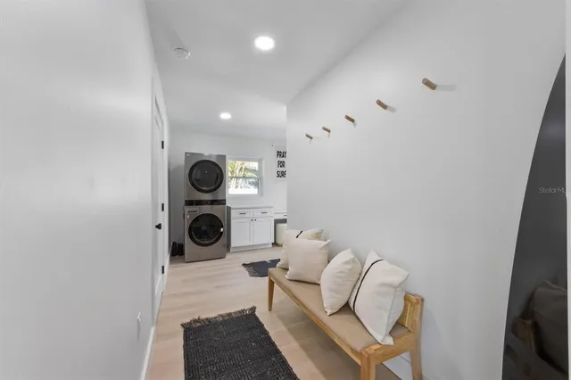 a living room with furniture and a mirror