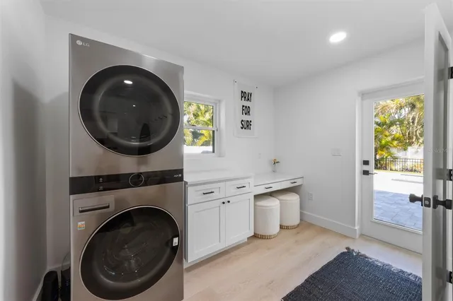 a view of a hallway with washer and dryer