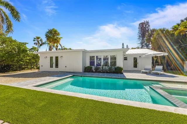 a front view of a house with a yard table and chairs