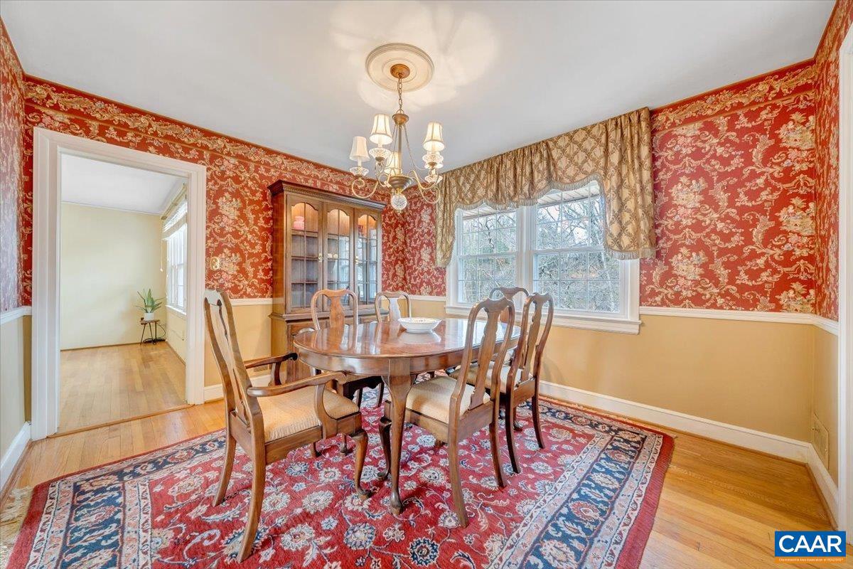 3558 Hartland Road Southwest Roanoke, VA 24015 - Photo 16 of 73 a view of a dining room with furniture window and wooden floor