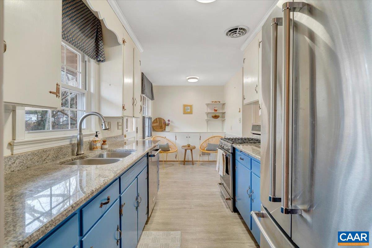 3558 Hartland Road Southwest Roanoke, VA 24015 - Photo 24 of 73 a kitchen with stainless steel appliances granite countertop a sink and a refrigerator
