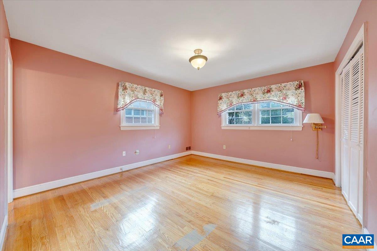 3558 Hartland Road Southwest Roanoke, VA 24015 - Photo 33 of 73 a view of an empty room with a window and wooden floor