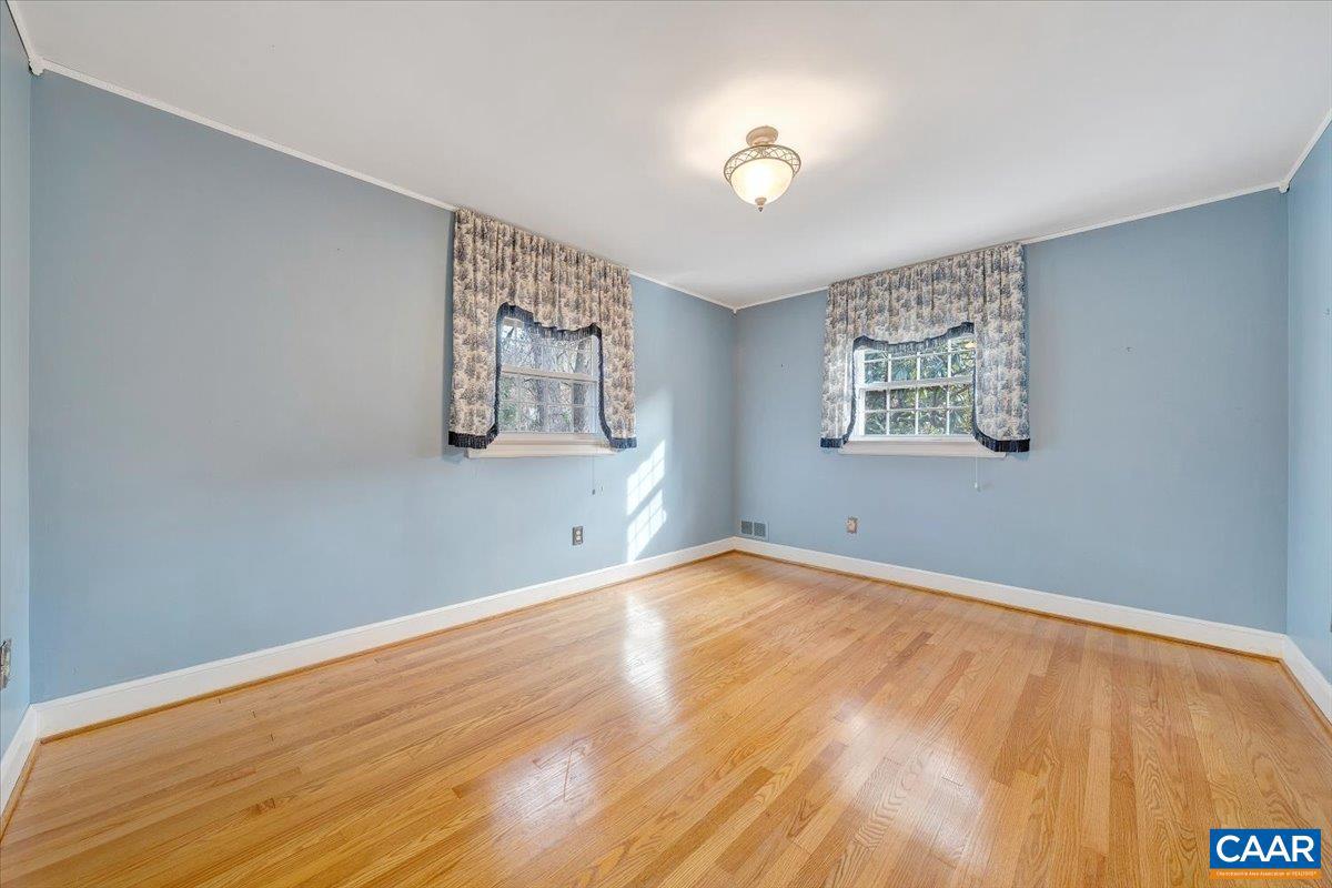 3558 Hartland Road Southwest Roanoke, VA 24015 - Photo 37 of 73 a view of an empty room with window and wooden floor