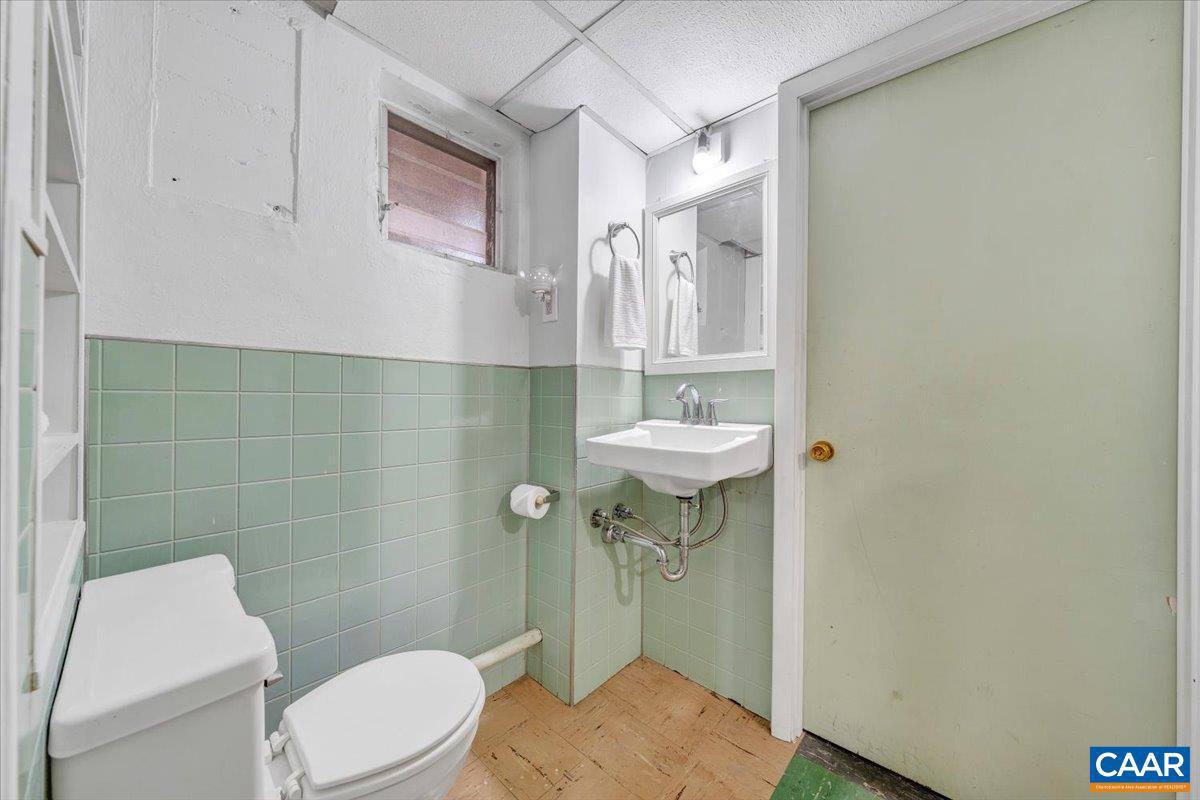 3558 Hartland Road Southwest Roanoke, VA 24015 - Photo 48 of 73 a bathroom with a sink a toilet and shower