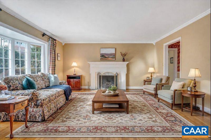 3558 Hartland Road Southwest Roanoke, VA 24015 - Photo 7 of 73 a living room with furniture and a fireplace