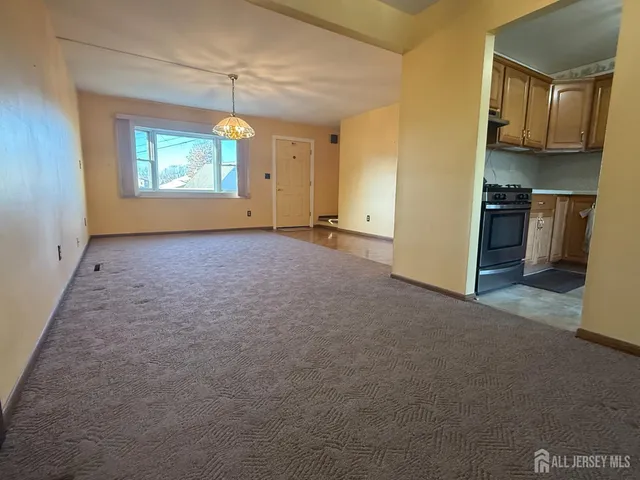 a view of a room with a ceiling fan