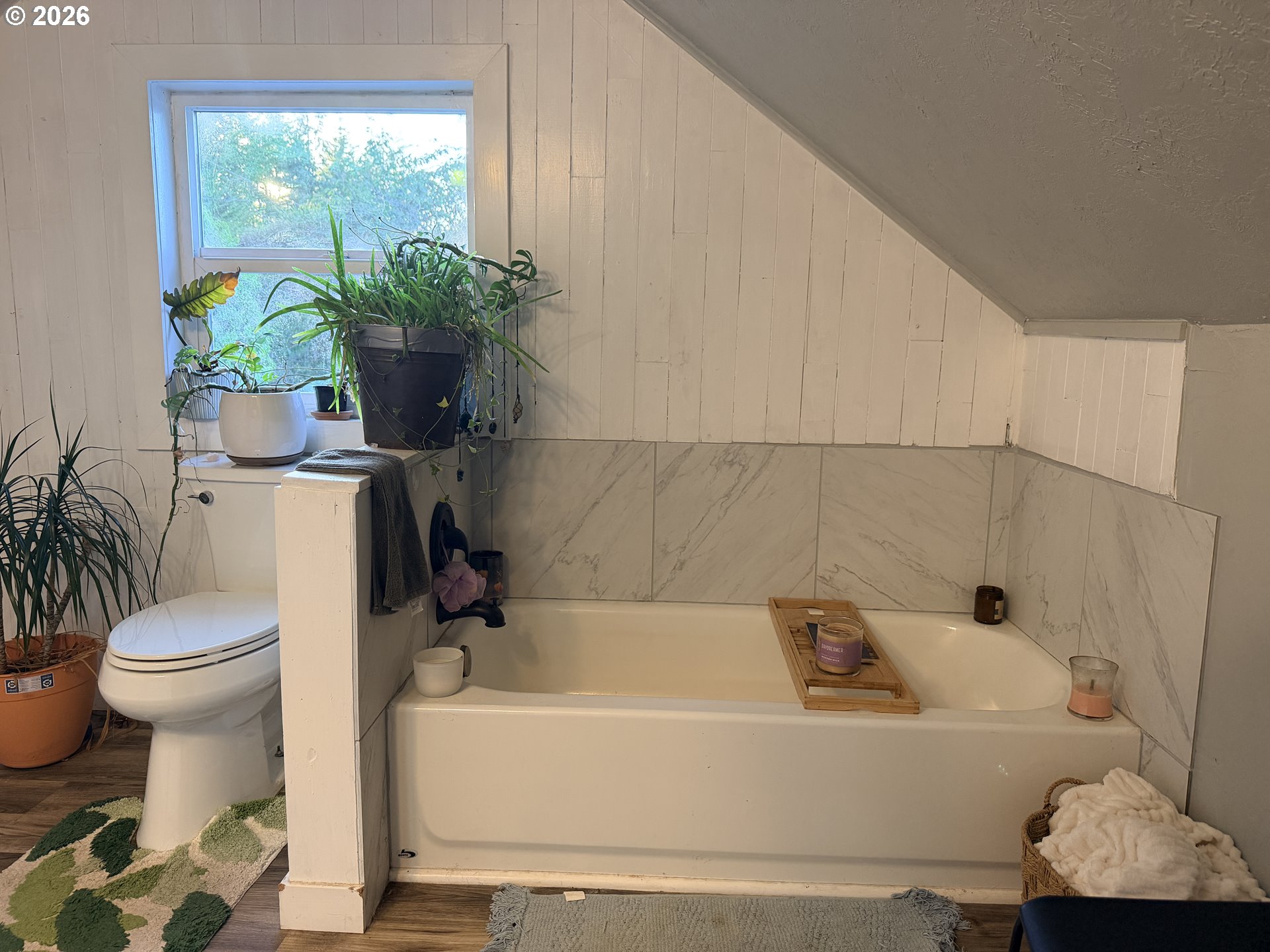 677 Southeast Moffitt Road Waldport, OR 97394 - Photo 27 of 36 a white bath tub sitting next to a white toilet