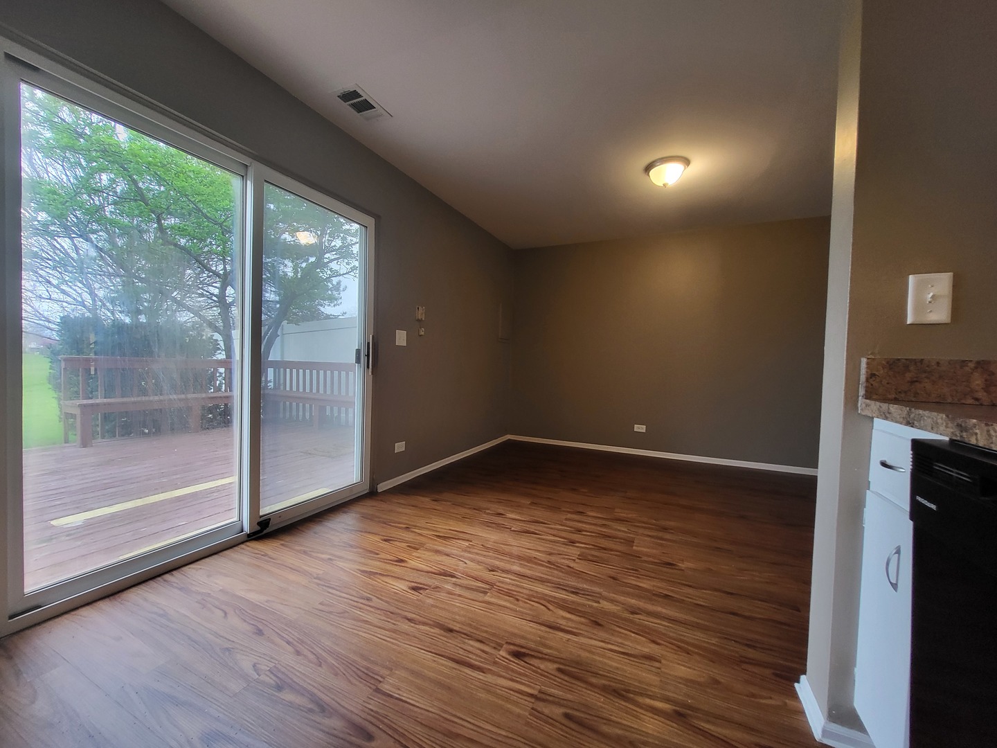 200 Rodenburg Road Roselle, IL 60172 - Photo 13 of 15 a view of empty room with wooden floor and fan