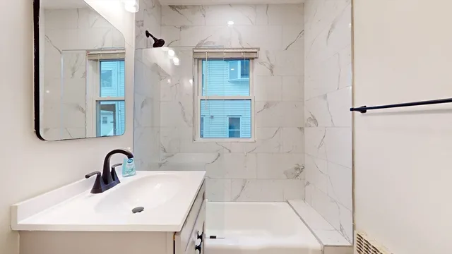 a bathroom with a sink and a bathtub