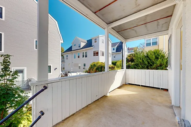 a view of balcony and yard