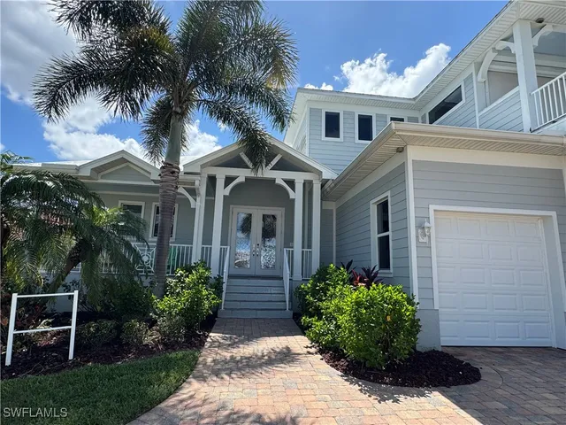 front view of a house with a small yard