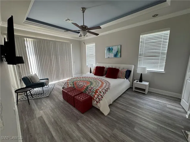 a bedroom with a bed and a chair