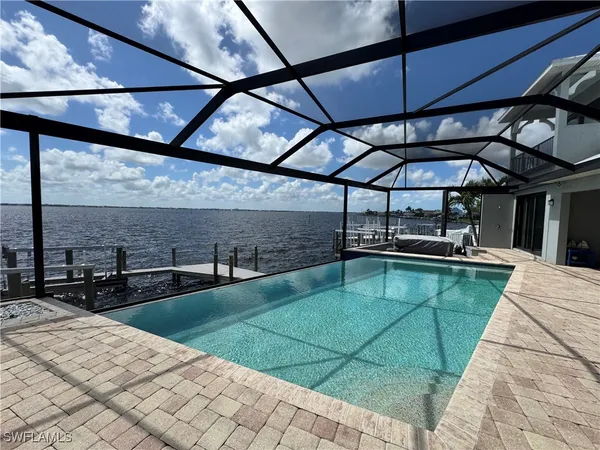a view of a swimming pool with a patio