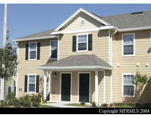826 Enterprise Road, Unit 7101 DeBary, FL 32713 - Photo 1 of 1 a view of a brick house with large windows