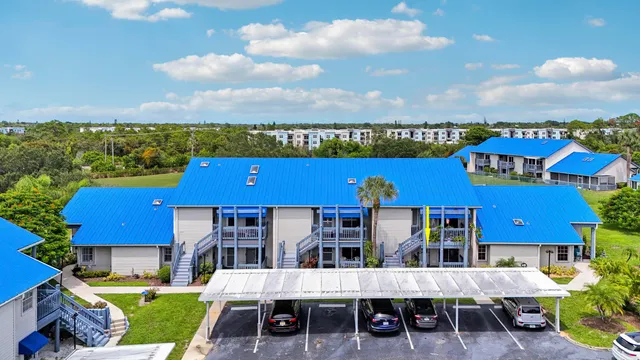 an aerial view of a house with a garden and sitting space