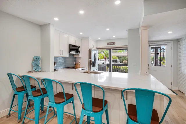 a bedroom with a bed and a ceiling fan