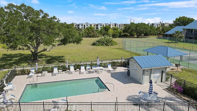 swimming pool with outdoor seating and yard