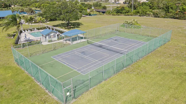 a kitchen with stainless steel appliances a refrigerator and a stove top oven