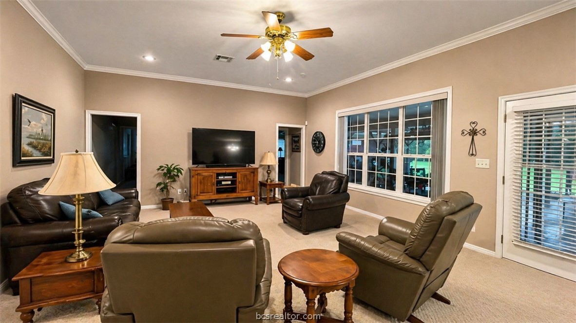 10432 Sammys Road Bremond, TX 76629 - Photo 12 of 47 a living room with furniture and a flat screen tv