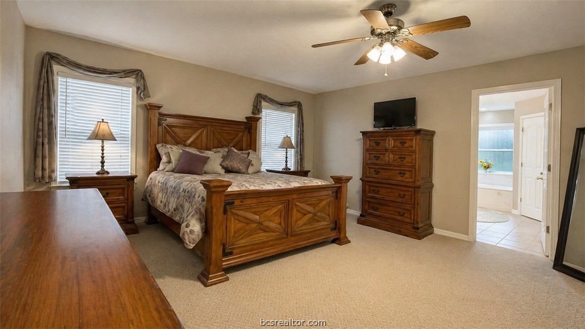 10432 Sammys Road Bremond, TX 76629 - Photo 15 of 47 a bedroom with a bed and a chandelier