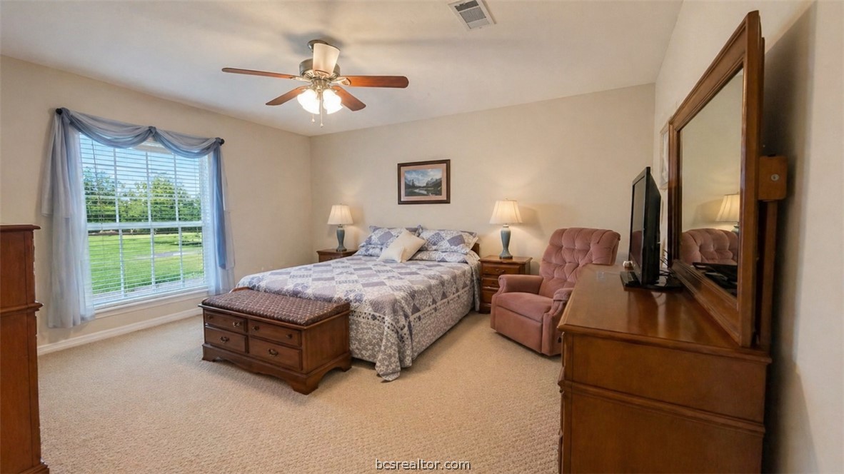 10432 Sammys Road Bremond, TX 76629 - Photo 18 of 47 a living room with furniture and a flat screen tv