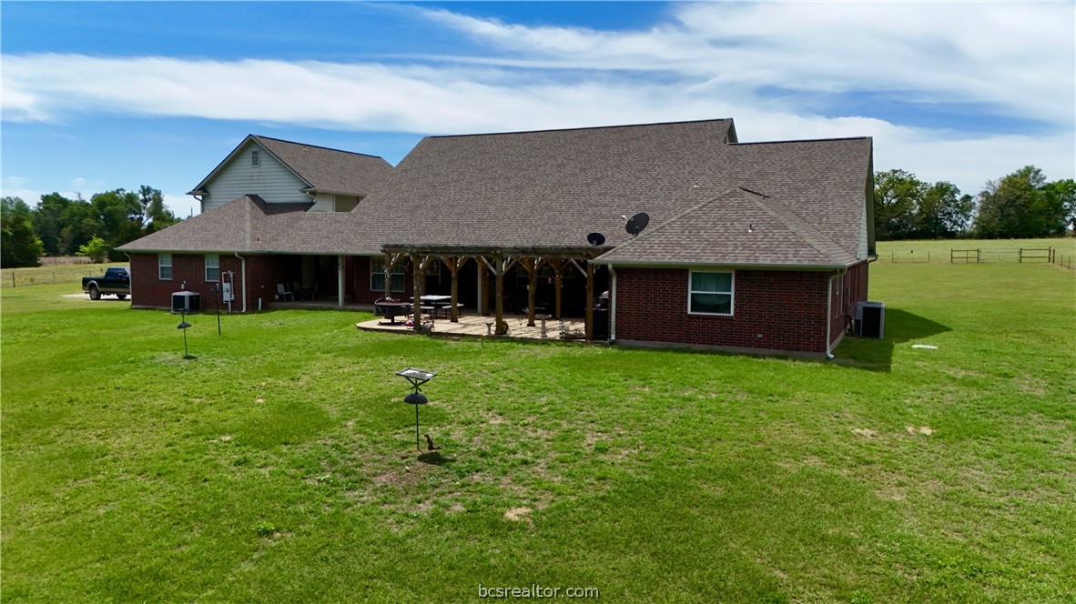 10432 Sammys Road Bremond, TX 76629 - Photo 21 of 47 a front view of a house with garden