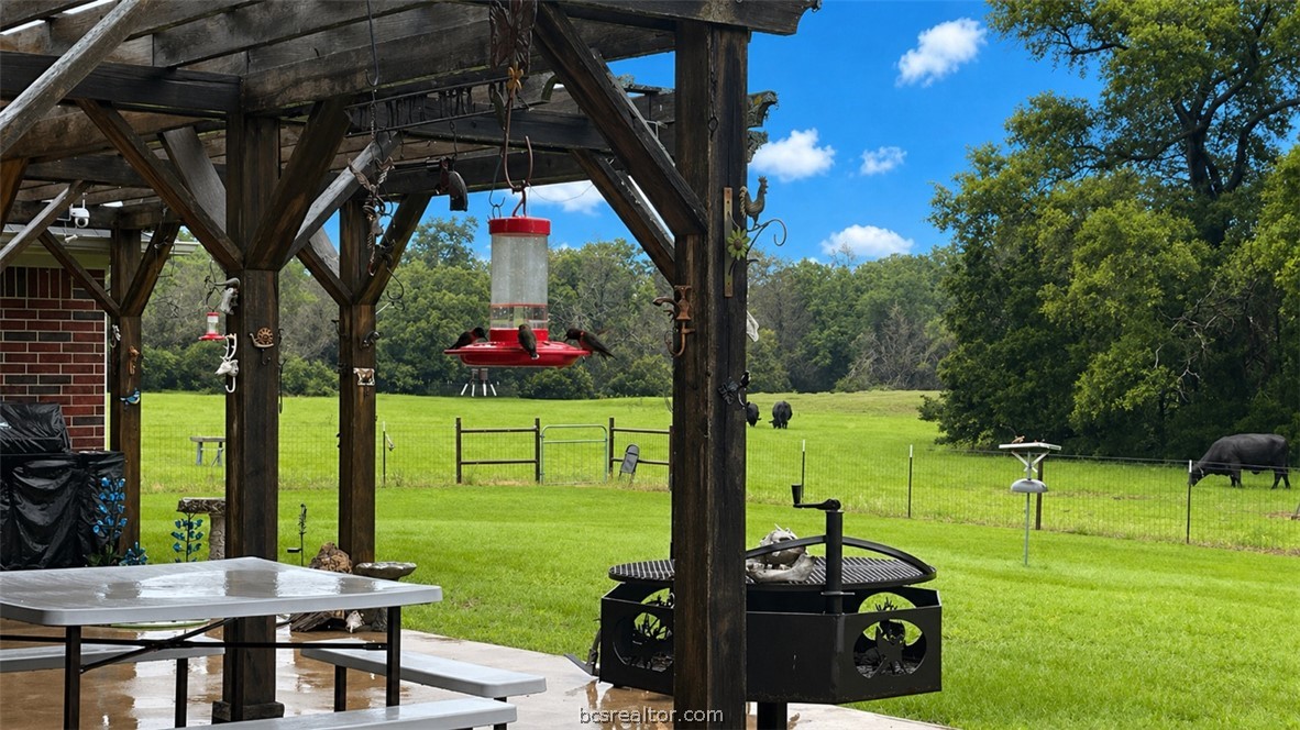 10432 Sammys Road Bremond, TX 76629 - Photo 23 of 47 a view of a chairs and table in backyard