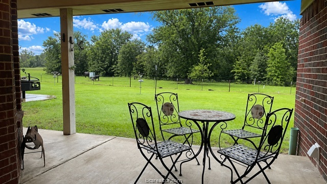 10432 Sammys Road Bremond, TX 76629 - Photo 24 of 47 a view of a chairs and table in patio
