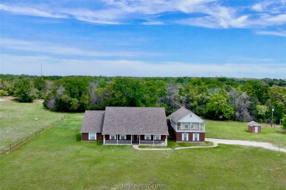 10432 Sammys Road Bremond, TX 76629 - Photo 3 of 47 a view of a house with a big yard and large trees