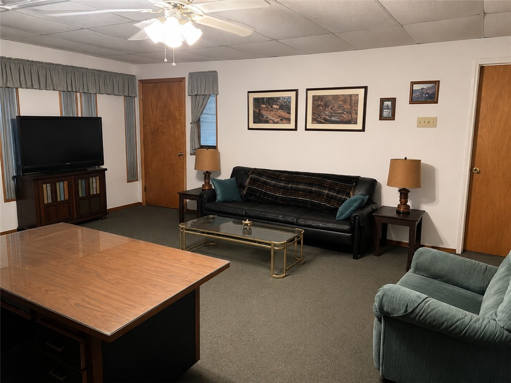 10432 Sammys Road Bremond, TX 76629 - Photo 37 of 47 a living room with furniture and a flat screen tv