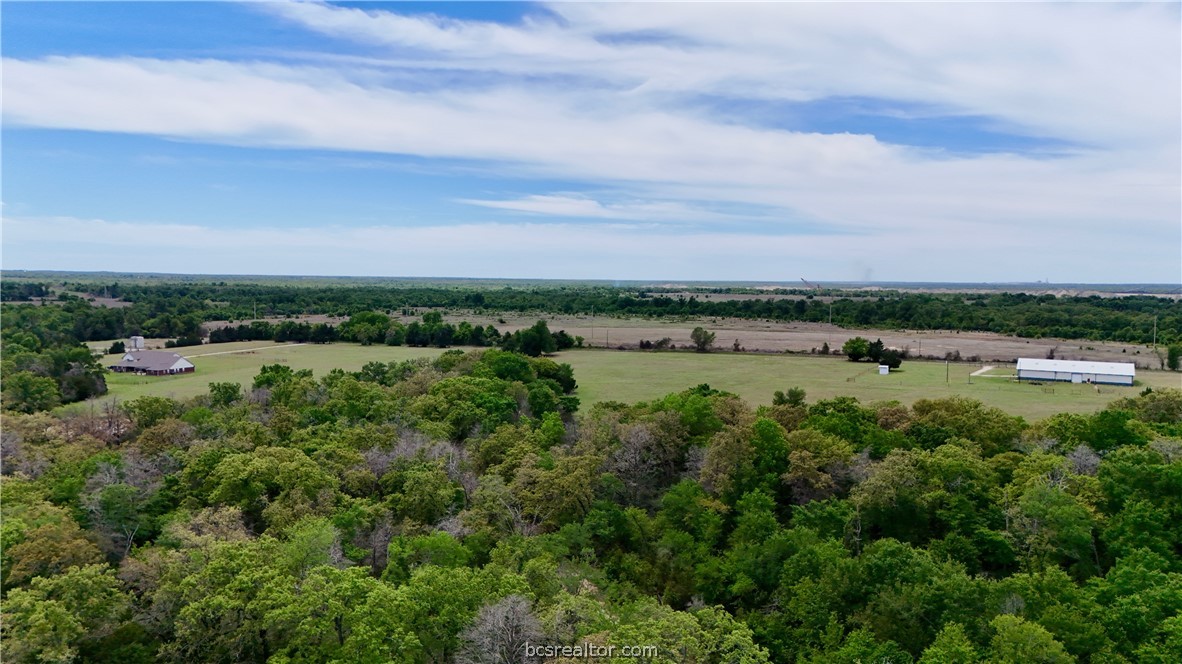 10432 Sammys Road Bremond, TX 76629 - Photo 45 of 47 an aerial view of a city with lots of residential buildings and lake view in back