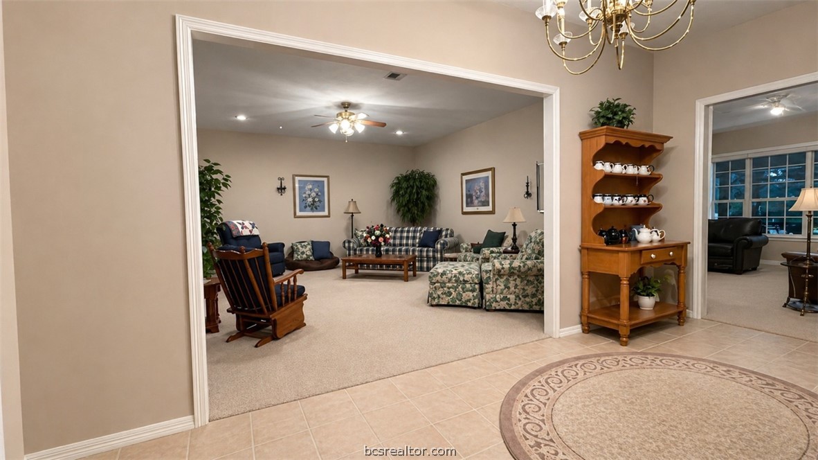10432 Sammys Road Bremond, TX 76629 - Photo 6 of 47 a view of a livingroom with furniture and a chandelier