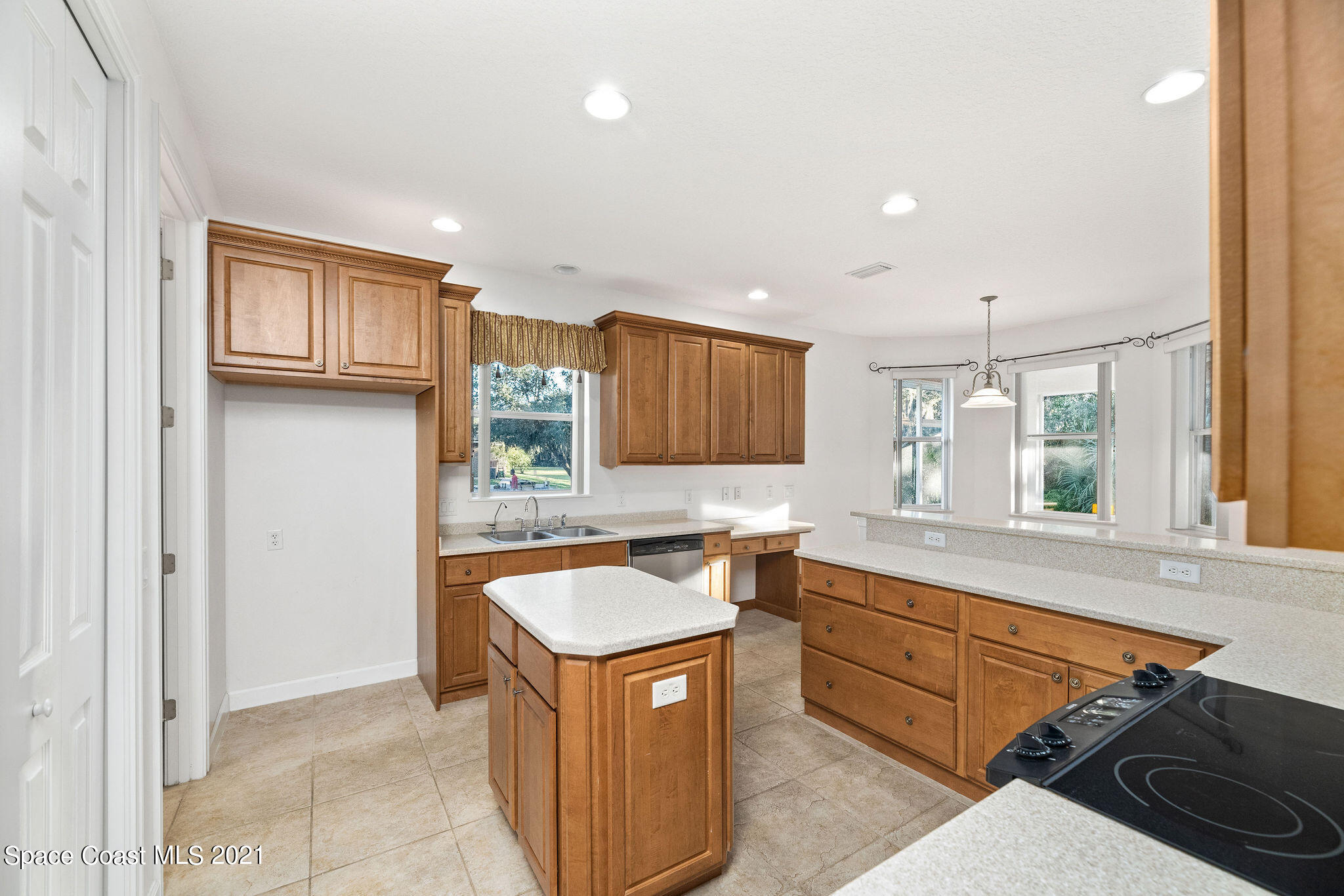 3748 Turtle Mound Road Melbourne, FL 32934 - Photo 13 of 68 a kitchen with a sink stove and cabinets