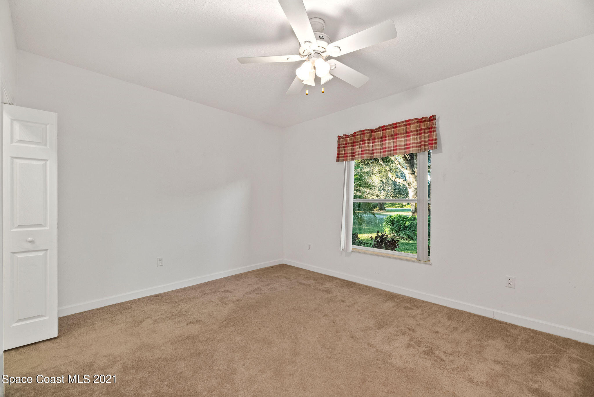 3748 Turtle Mound Road Melbourne, FL 32934 - Photo 17 of 68 an empty room with a window