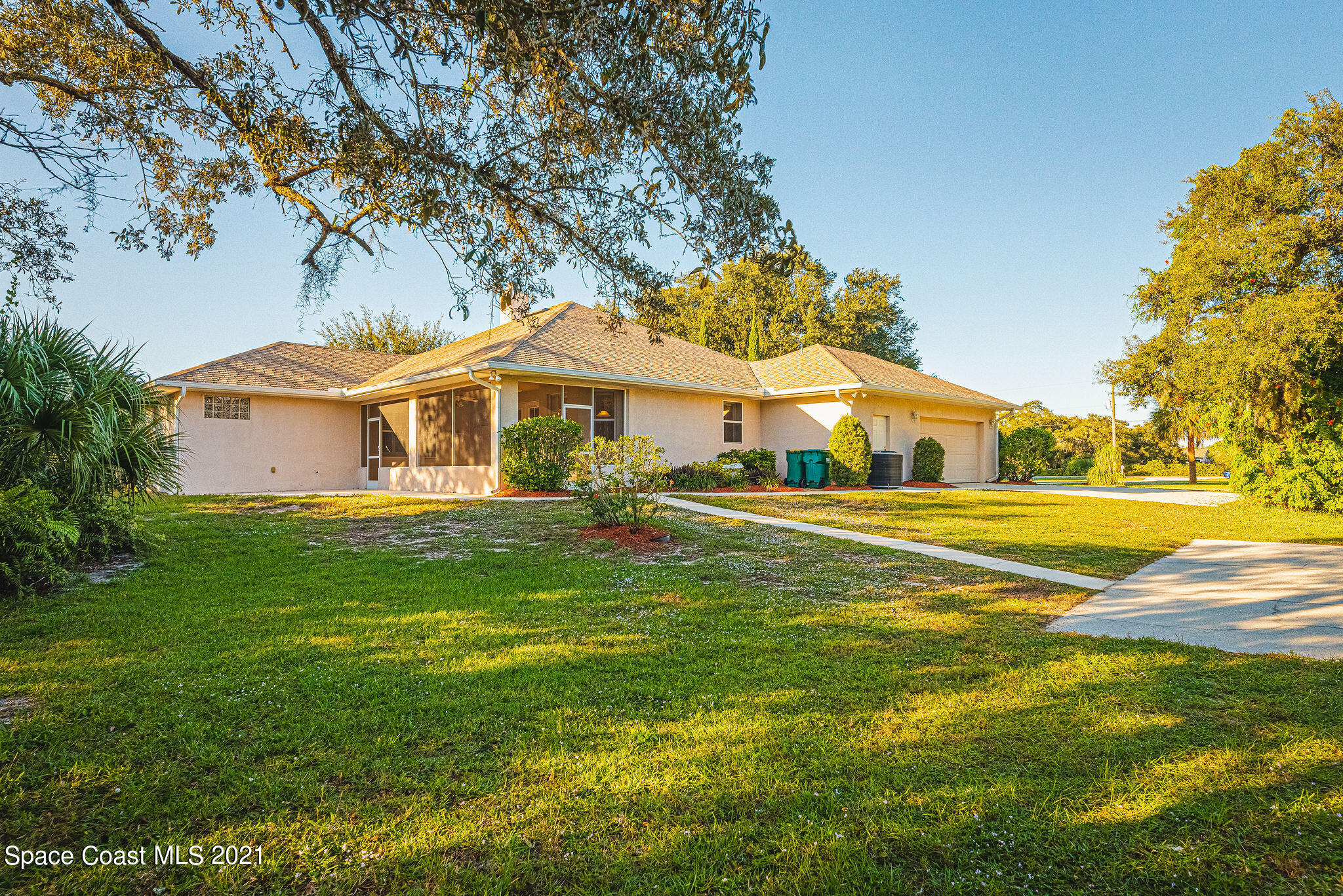 3748 Turtle Mound Road Melbourne, FL 32934 - Photo 37 of 68 a front view of a house with a yard