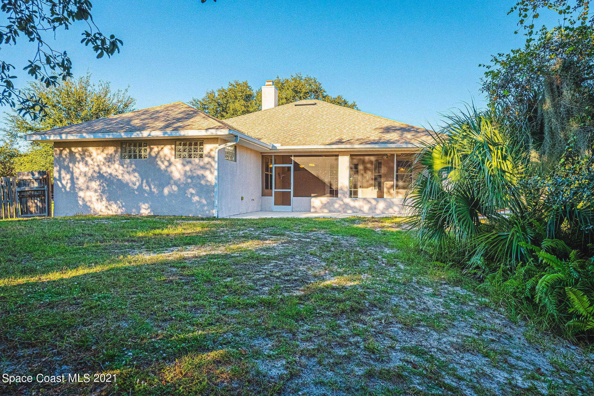 3748 Turtle Mound Road Melbourne, FL 32934 - Photo 41 of 68 a front view of house with yard and green space