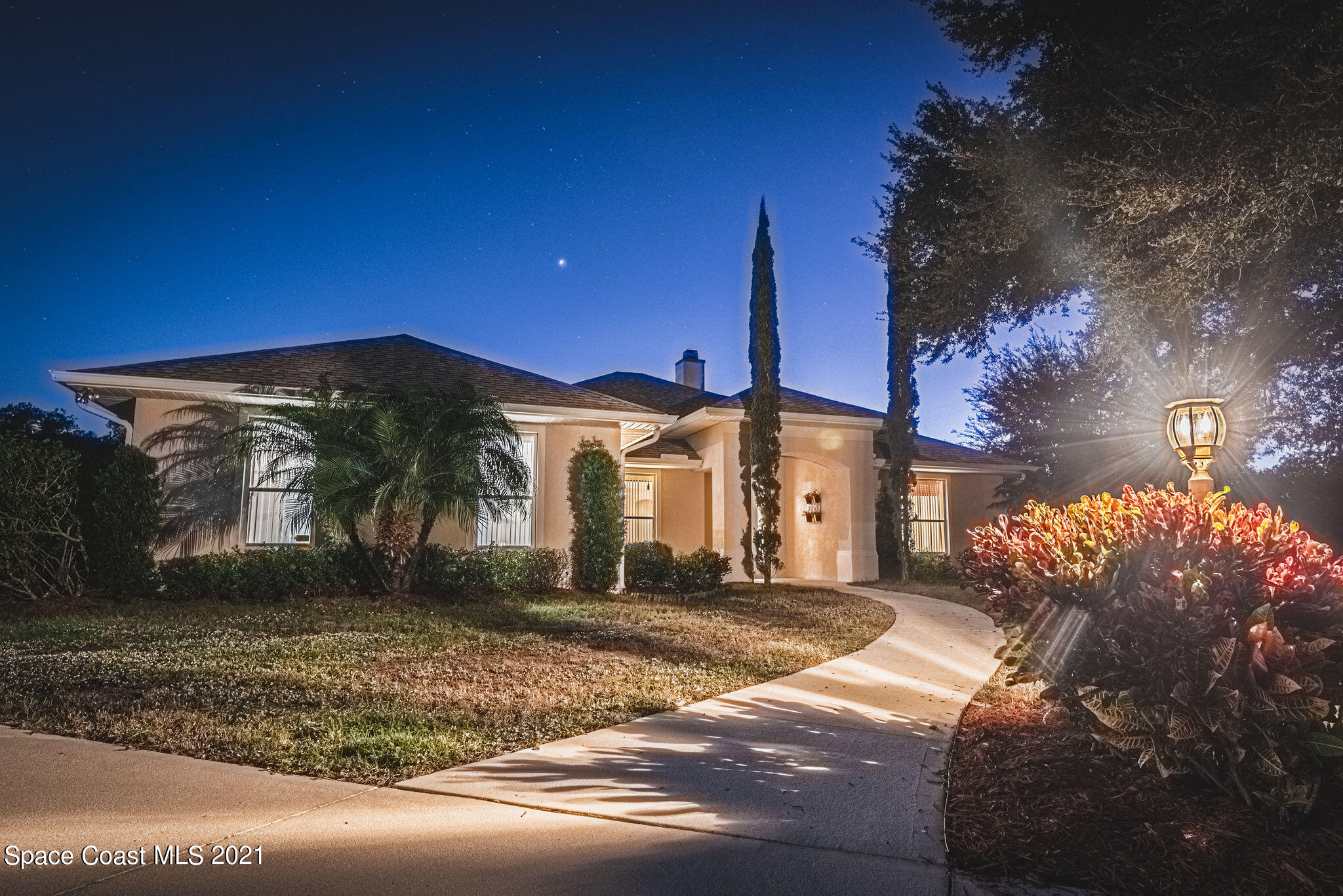 3748 Turtle Mound Road Melbourne, FL 32934 - Photo 49 of 68 a front view of a house with a yard