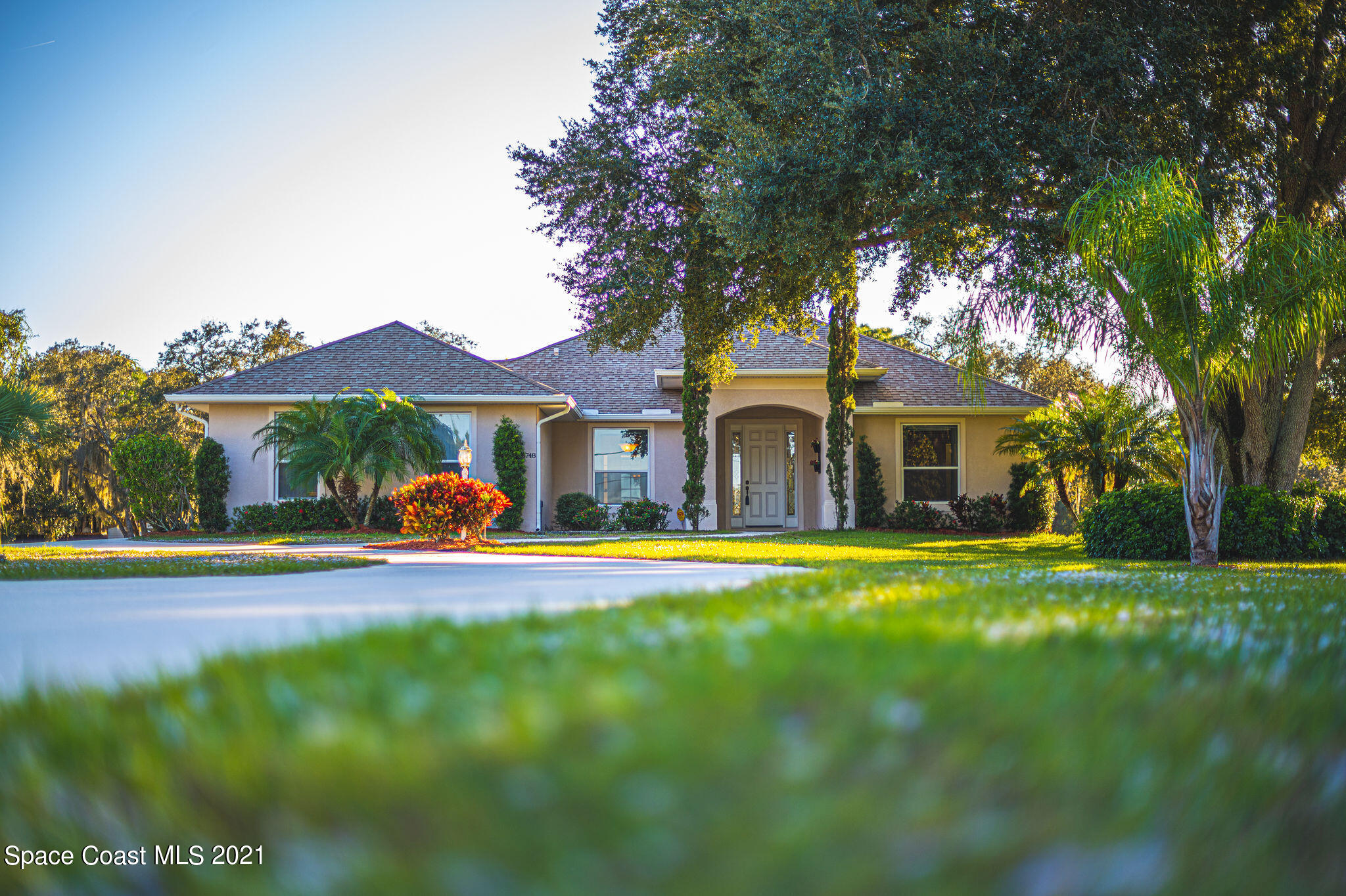 3748 Turtle Mound Road Melbourne, FL 32934 - Photo 54 of 68 a view of a house with a yard and sitting area