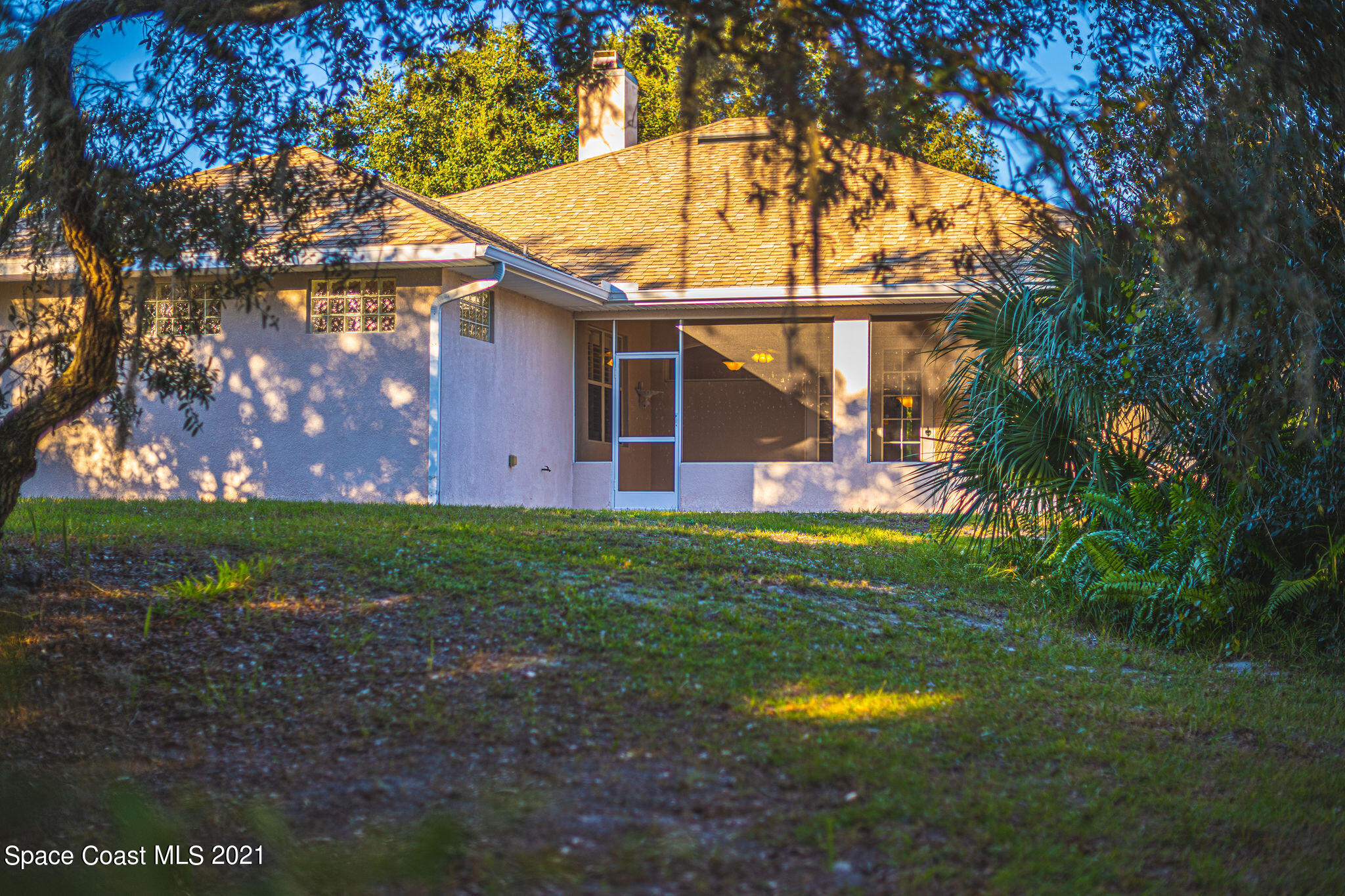 3748 Turtle Mound Road Melbourne, FL 32934 - Photo 59 of 68 a backyard of a house with lots of green space