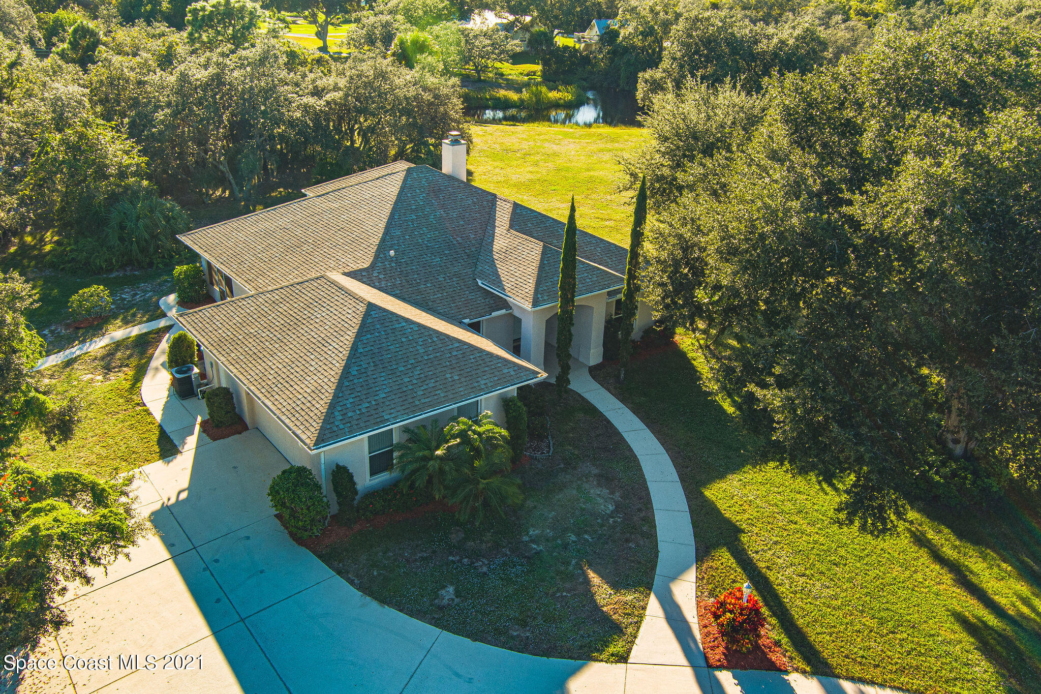 3748 Turtle Mound Road Melbourne, FL 32934 - Photo 66 of 68 a view of a swimming pool with a patio