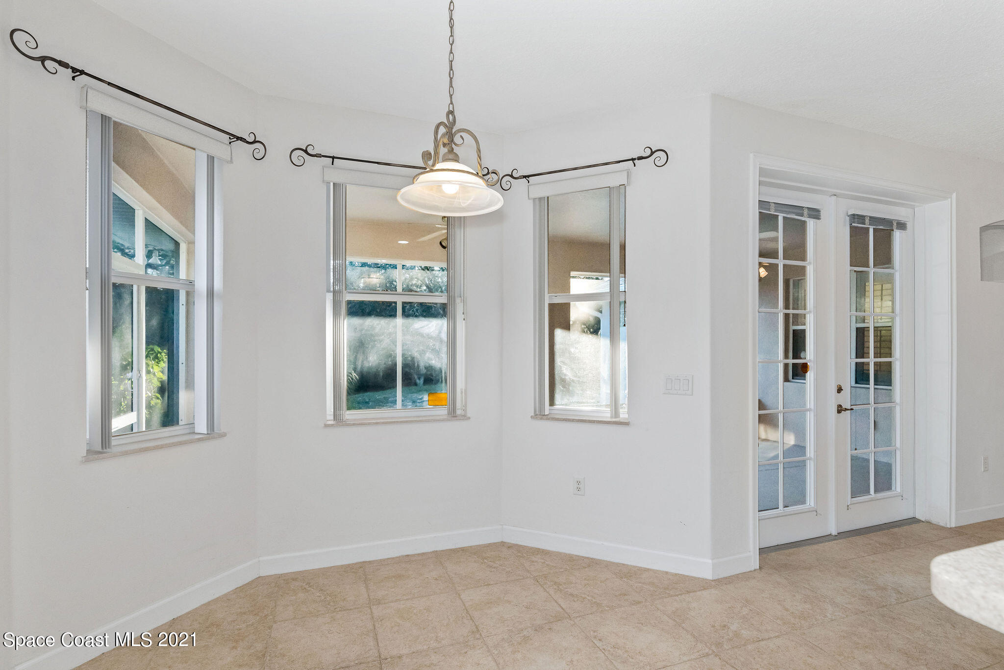 3748 Turtle Mound Road Melbourne, FL 32934 - Photo 10 of 68 a view of an empty room with a window