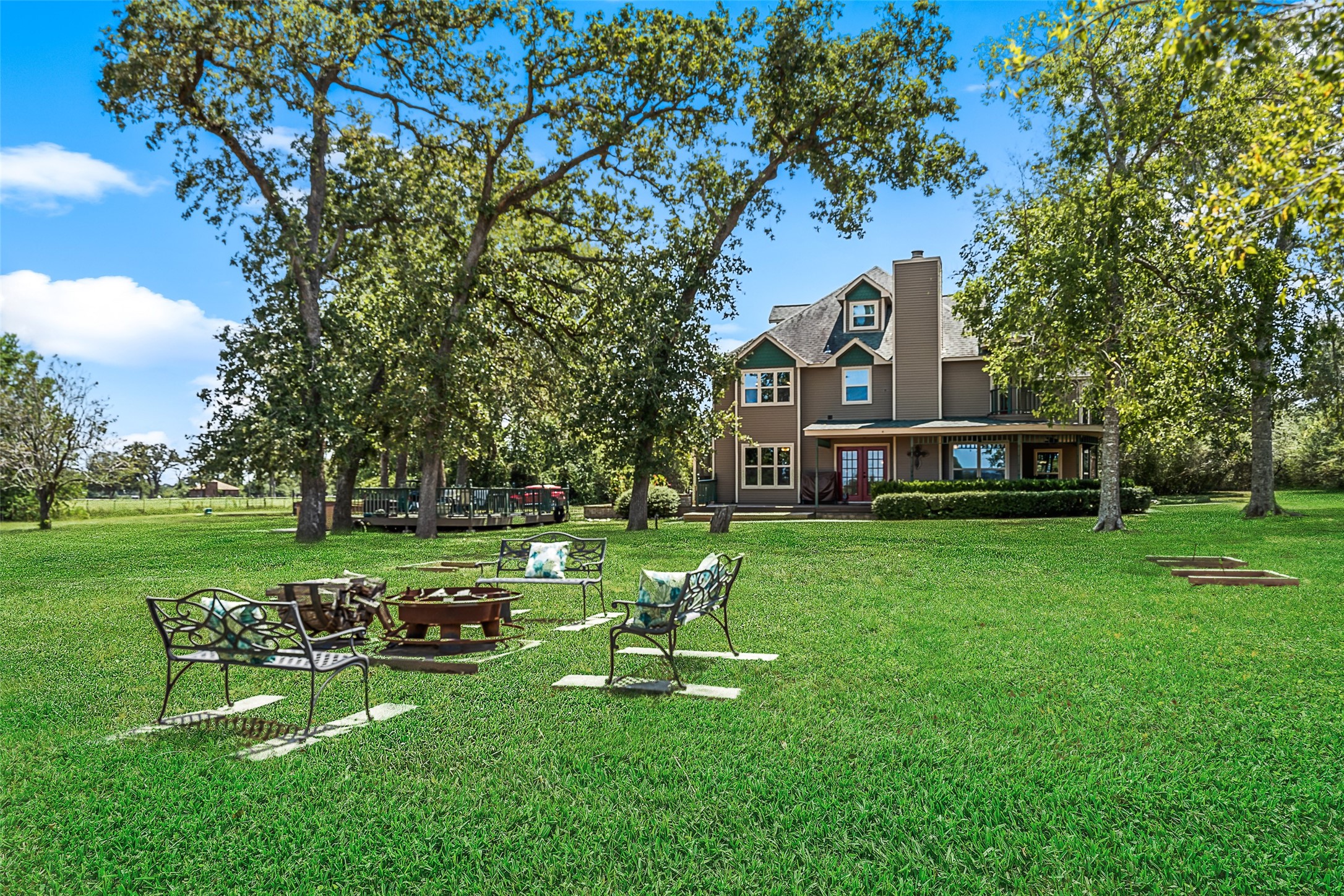 25948 Nelson Road Hempstead, TX 77445 - Photo 36 of 46 Generous green space shaded by mature trees, providing plenty of room to relax, gather, and enjoy the outdoors.