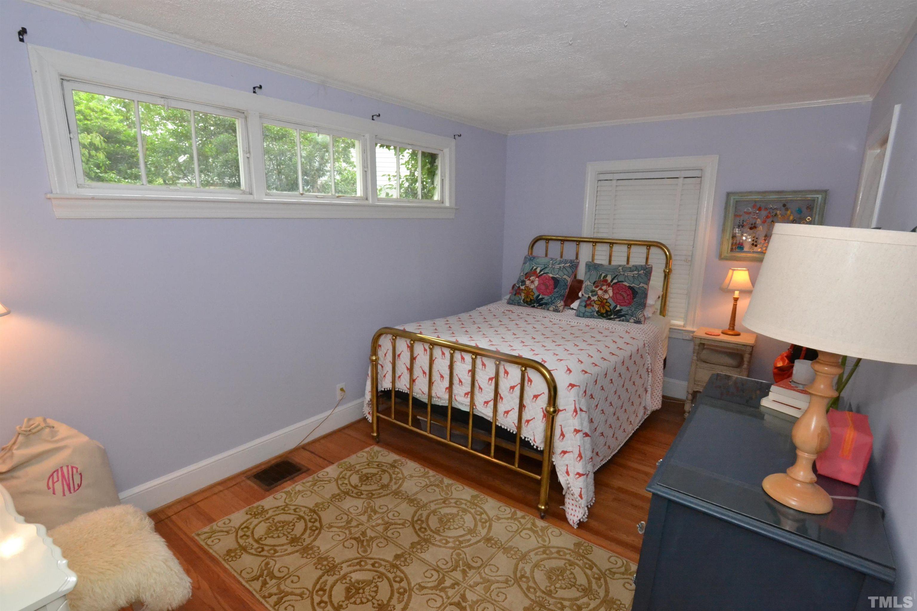 1004 Brooks Avenue Raleigh, NC 27607 - Photo 11 of 17 a bedroom with a bed and window
