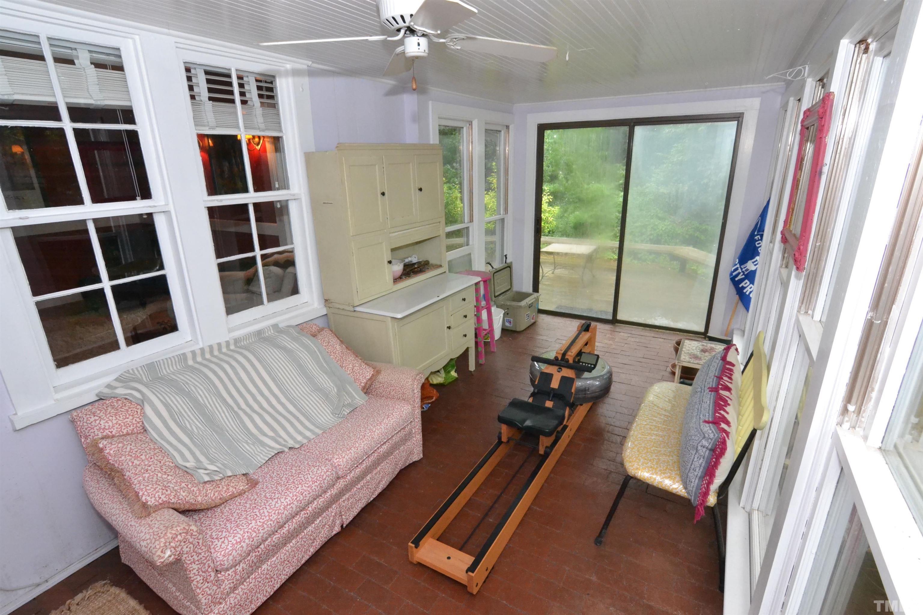 1004 Brooks Avenue Raleigh, NC 27607 - Photo 12 of 17 a living room with furniture and a flat screen tv