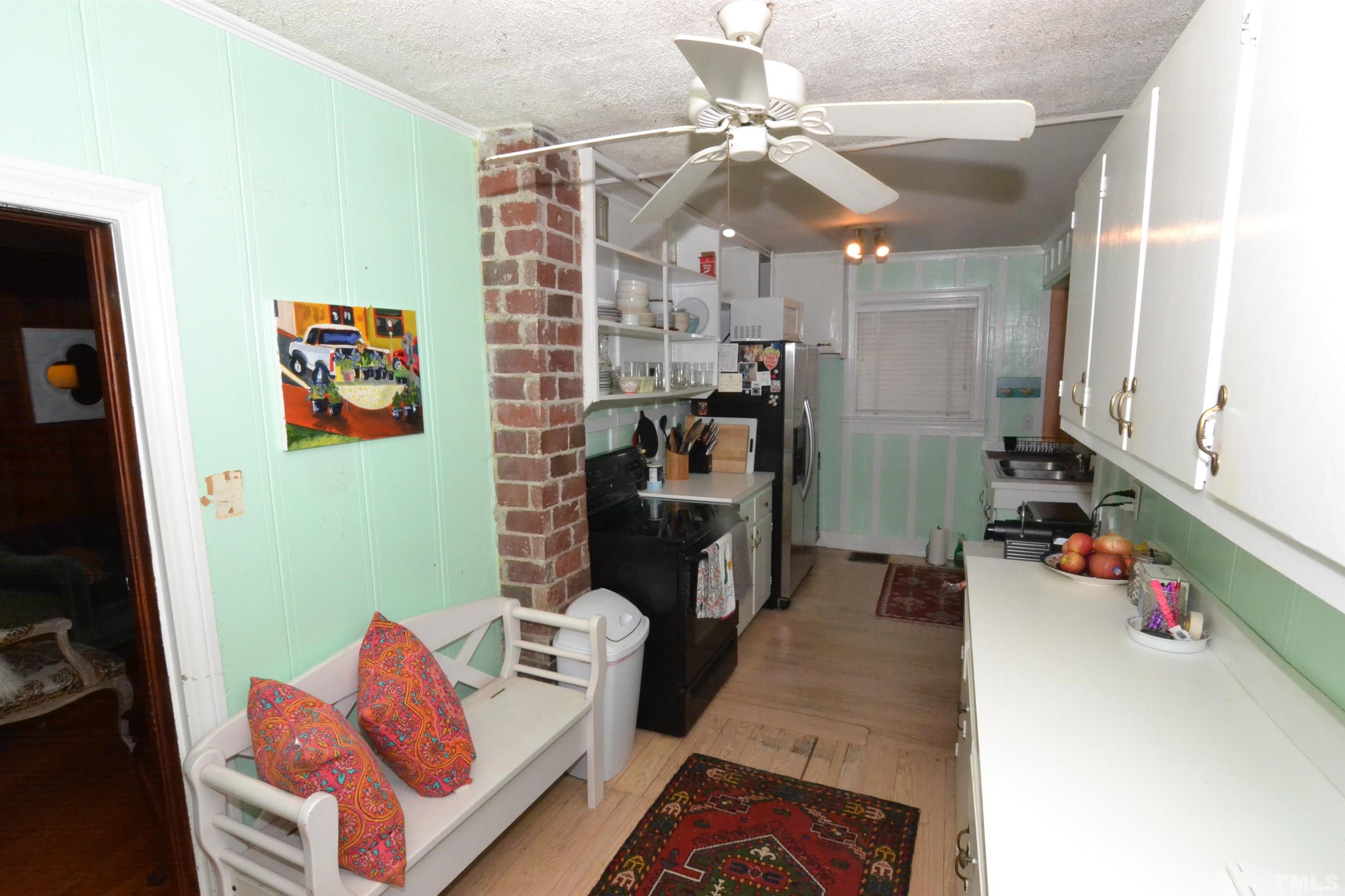 1004 Brooks Avenue Raleigh, NC 27607 - Photo 5 of 17 a living room with furniture and a flat screen tv
